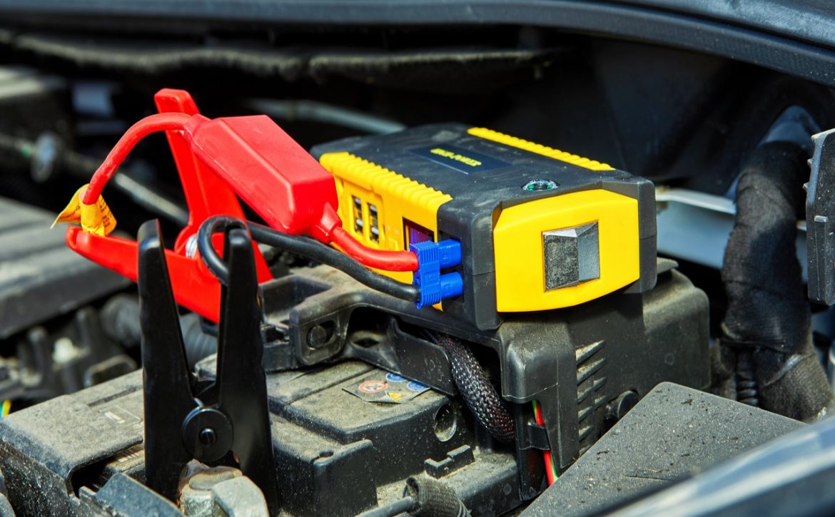 charging a car with electricity through cables from a compact battery